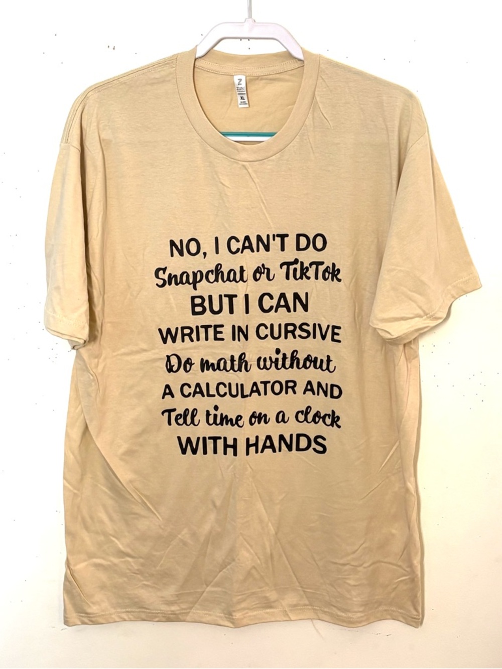 Zuni Sportswear Graphic Short Sleeve Tee - Beige with Black Text. Size XL. NWT.